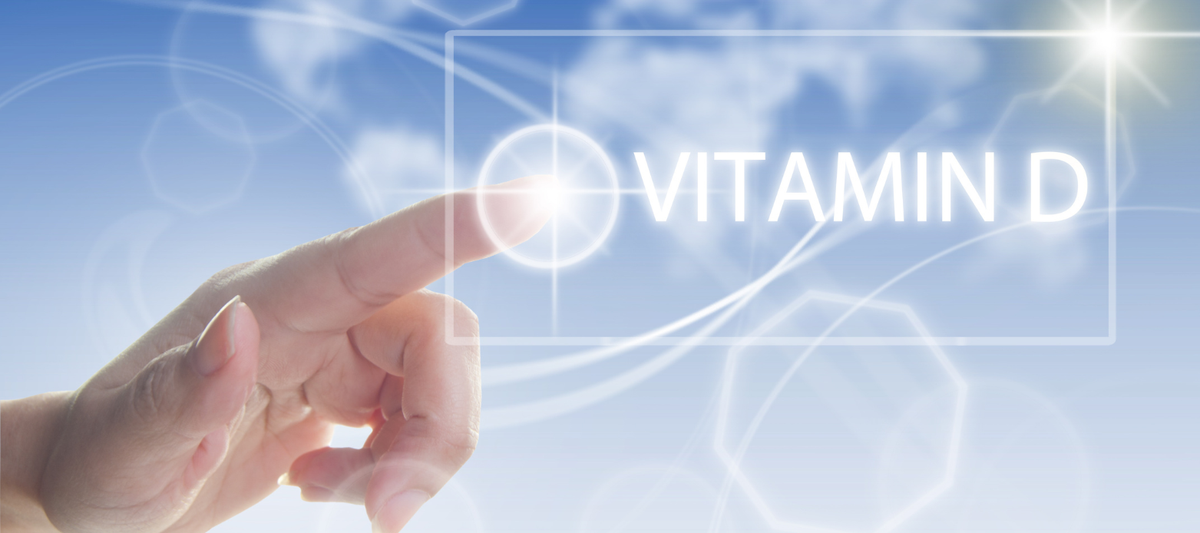 Der Schriftzug 'Vitamin D3' aus weißen Kapseln auf gelbem Hintergrund
